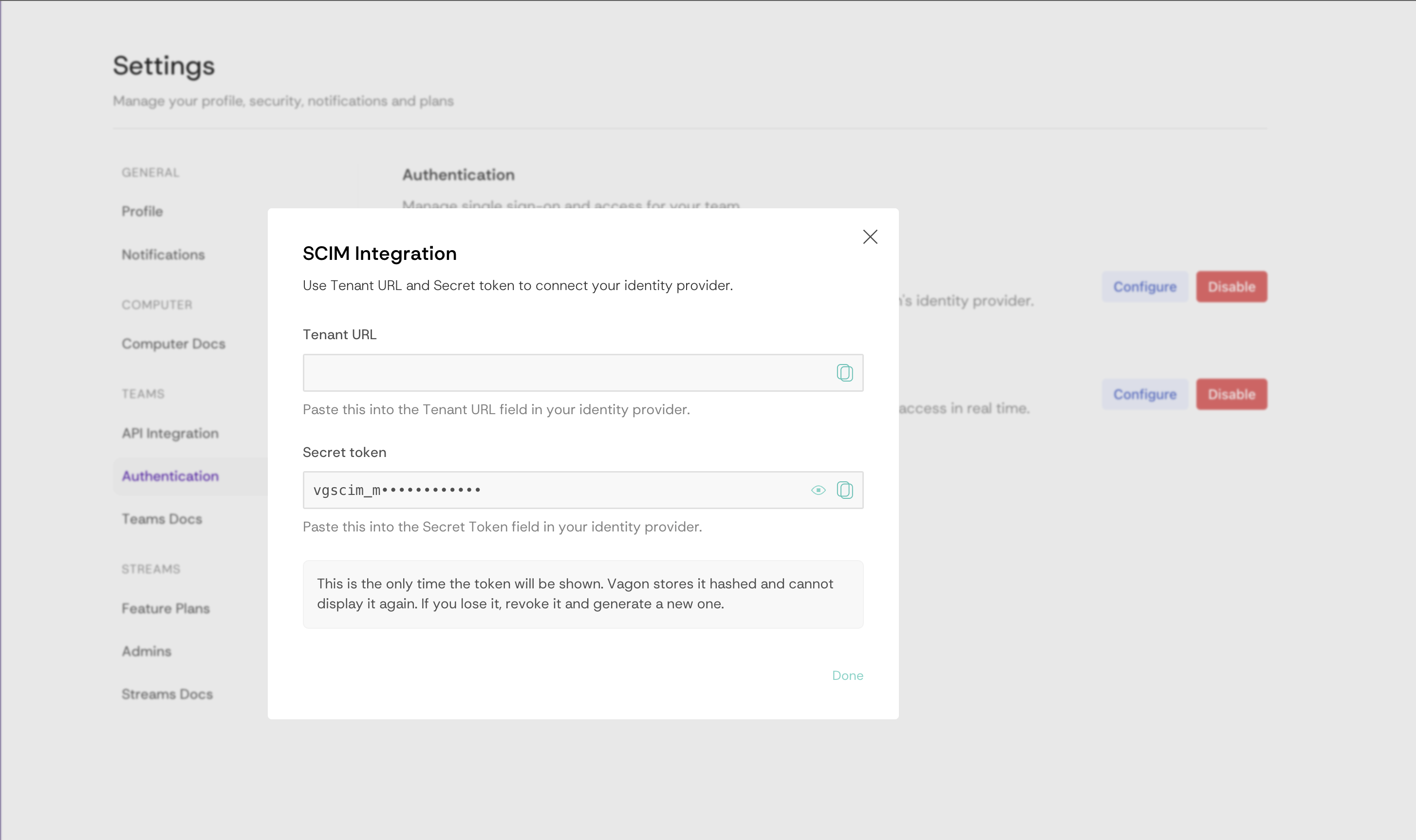 SCIM Integration dialog showing the Tenant URL and Secret token